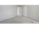 Bright bedroom featuring neutral walls, plush carpeting, and ample closet space at 439 Royal Bridge Dr, Las Vegas, NV 89178