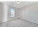 This bedroom features a bright window and neutral walls, with plush carpeting for comfort at 439 Royal Bridge Dr, Las Vegas, NV 89178