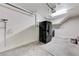 Spacious garage with ample storage, utility connections and overhead lighting at 439 Royal Bridge Dr, Las Vegas, NV 89178