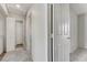 Hallway featuring multiple doors, laundry machines, and carpeted floors at 439 Royal Bridge Dr, Las Vegas, NV 89178
