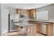 The kitchen has stainless steel appliances, a window, and wood cabinets at 439 Royal Bridge Dr, Las Vegas, NV 89178
