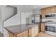 Modern kitchen featuring stainless steel appliances, wood cabinets, and an island at 439 Royal Bridge Dr, Las Vegas, NV 89178