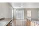 Bright kitchen with hardwood floors, a large window, and sliding glass door at 439 Royal Bridge Dr, Las Vegas, NV 89178