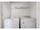 Convenient laundry closet includes a washer, dryer, and overhead shelving at 439 Royal Bridge Dr, Las Vegas, NV 89178