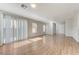 Spacious living room area features beautiful wood flooring and recessed lighting at 439 Royal Bridge Dr, Las Vegas, NV 89178