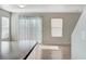 Bright living room featuring hardwood floors, large windows, and a sliding glass door at 439 Royal Bridge Dr, Las Vegas, NV 89178