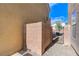 A side yard features a secure metal gate and block wall, providing privacy and access to other areas at 439 Royal Bridge Dr, Las Vegas, NV 89178