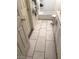 Bathroom featuring tile flooring, tub, toilet, vanity, and a door at 45 Logan Ct, Las Vegas, NV 89110