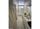Bathroom featuring tile flooring, tub, toilet, vanity, and a door at 45 Logan Ct, Las Vegas, NV 89110