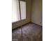 Modest bedroom featuring neutral carpet, large windows, and standard lighting at 45 Logan Ct, Las Vegas, NV 89110