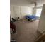 Bedroom with carpet, window, door, and fan, showing functional living space at 45 Logan Ct, Las Vegas, NV 89110