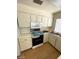 Functional kitchen with white cabinetry, laminate countertops, and essential appliances at 45 Logan Ct, Las Vegas, NV 89110