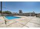 Backyard featuring a refreshing pool, concrete patio, and block wall for privacy at 4558 Sheppard Dr, Las Vegas, NV 89122