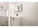 Bathroom vanity featuring black hardware, modern fixtures and grey cabinetry at 4558 Sheppard Dr, Las Vegas, NV 89122