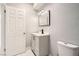 Stylish bathroom with a floating vanity, modern fixtures, and a toilet at 4558 Sheppard Dr, Las Vegas, NV 89122