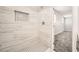 Contemporary shower with stylish tile and convenient storage niche at 4558 Sheppard Dr, Las Vegas, NV 89122