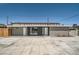 Home with modern exterior features a spacious parking area and decorative rock accents at 4558 Sheppard Dr, Las Vegas, NV 89122