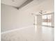 Bright living room features white tile flooring and lots of natural light from a large window at 4558 Sheppard Dr, Las Vegas, NV 89122