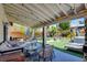 Charming covered patio with dining and lounge areas, perfect for outdoor entertaining at 4615 Stearman Dr, North Las Vegas, NV 89031