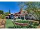 Spacious backyard with a covered patio, hot tub, and hammock for outdoor relaxation and enjoyment at 4615 Stearman Dr, North Las Vegas, NV 89031