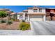 Charming two-story home with a well-manicured lawn and a two-car garage, offering great curb appeal at 4615 Stearman Dr, North Las Vegas, NV 89031