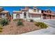 Charming two-story home with a well-manicured lawn and a two-car garage, offering great curb appeal at 4615 Stearman Dr, North Las Vegas, NV 89031