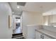 Hallway with neutral tones, a view of the staircase, and an office at 4615 Stearman Dr, North Las Vegas, NV 89031