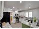 Bright kitchen features stainless steel appliances, granite counters, and opens to the dining room at 4615 Stearman Dr, North Las Vegas, NV 89031