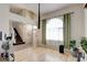Bright living room with wood floors, high ceilings, and ample natural light creates a warm ambiance at 4615 Stearman Dr, North Las Vegas, NV 89031