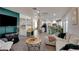 Open-concept living area with a kitchen view, stylish decor, and seamless flow at 4615 Stearman Dr, North Las Vegas, NV 89031