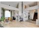 Spacious open-concept living space with hardwood floors, dining area, and lots of natural light at 4615 Stearman Dr, North Las Vegas, NV 89031