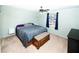 Well-lit bedroom with carpet, ceiling fan, and closet for storage at 4742 Monterrey Ave, Las Vegas, NV 89121
