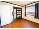 Bedroom with hardwood floors, window, closet, and blue and white trim at 4742 Monterrey Ave, Las Vegas, NV 89121