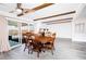 Dining area with wood table set, sliding glass door and beamed ceiling at 4742 Monterrey Ave, Las Vegas, NV 89121