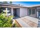 Home featuring a welcoming front entry with a fountain, covered porch and adjacent sliding glass door at 4742 Monterrey Ave, Las Vegas, NV 89121
