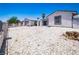 Exterior view of a home with well-maintained desert landscaping, spacious areas, and easy access at 4742 Monterrey Ave, Las Vegas, NV 89121