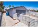 Exterior showing a spacious garage, desert landscaping, and gated access to the property at 4742 Monterrey Ave, Las Vegas, NV 89121