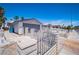 Property featuring a spacious two-car garage, block wall and secure front gate access at 4742 Monterrey Ave, Las Vegas, NV 89121