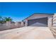 Home showcasing a large garage and wide driveway, with gated entry, and mature landscaping at 4742 Monterrey Ave, Las Vegas, NV 89121