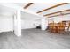 Bright living room with gray wood flooring and exposed beam ceiling at 4742 Monterrey Ave, Las Vegas, NV 89121