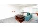 Comfortable living room featuring a cozy couch, wooden table, and mirrored wall at 4742 Monterrey Ave, Las Vegas, NV 89121