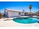 Backyard with a pool, diving board, and lounge areas, ideal for summer entertainment at 4742 Monterrey Ave, Las Vegas, NV 89121