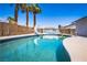 Sparkling pool with a slide and tropical landscaping, perfect for relaxation and fun at 4742 Monterrey Ave, Las Vegas, NV 89121