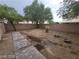 Picture of a backyard with a brick wall, rock garden, and stone path at 4821 Whisper Lake Ave, Las Vegas, NV 89131