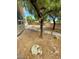 View of the backyard featuring stone pathway and trees offering shade at 4821 Whisper Lake Ave, Las Vegas, NV 89131