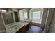 Bathroom featuring double sinks, tub, and walk-in shower at 4821 Whisper Lake Ave, Las Vegas, NV 89131