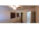 Cozy bedroom with ceiling fan, closet, and natural light at 4821 Whisper Lake Ave, Las Vegas, NV 89131