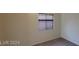 A bedroom with neutral carpet and a window with horizontal blinds at 4821 Whisper Lake Ave, Las Vegas, NV 89131
