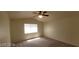 Bedroom featuring neutral walls, carpet flooring, ceiling fan and a window providing natural light at 4821 Whisper Lake Ave, Las Vegas, NV 89131