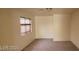 Bedroom featuring neutral walls, carpet flooring, and a window providing natural light at 4821 Whisper Lake Ave, Las Vegas, NV 89131
